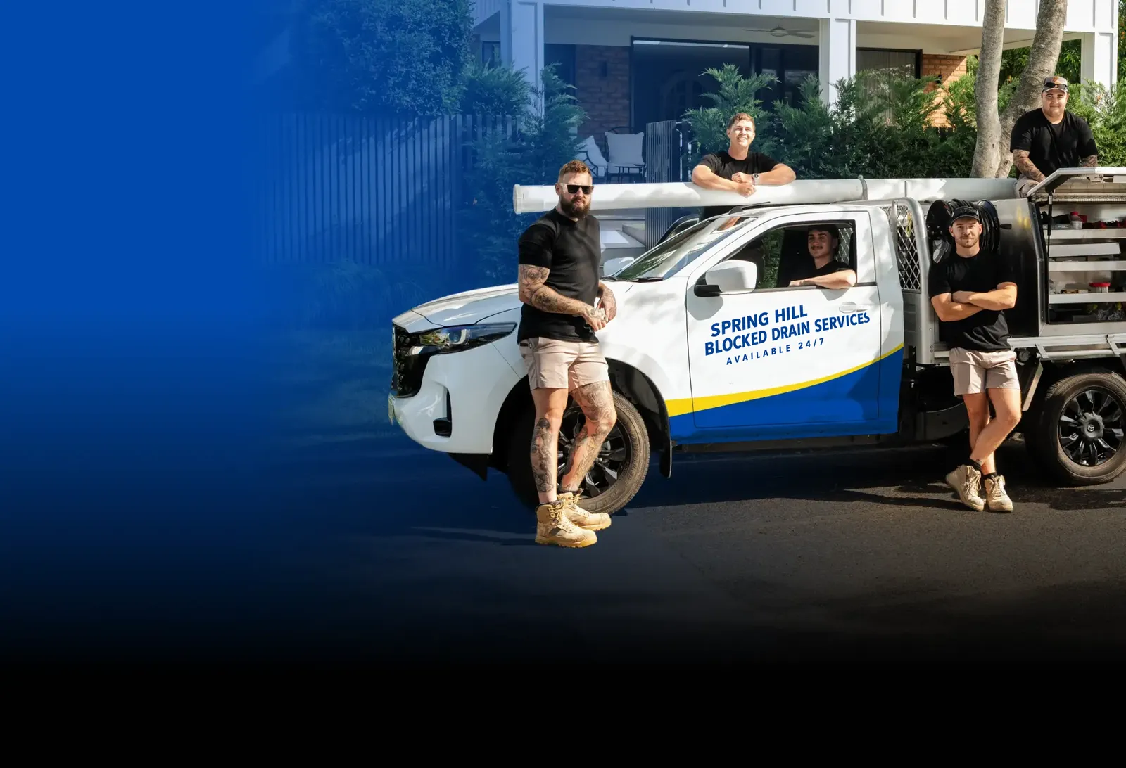 Spring Hill Blocked Drain Services team with the ute